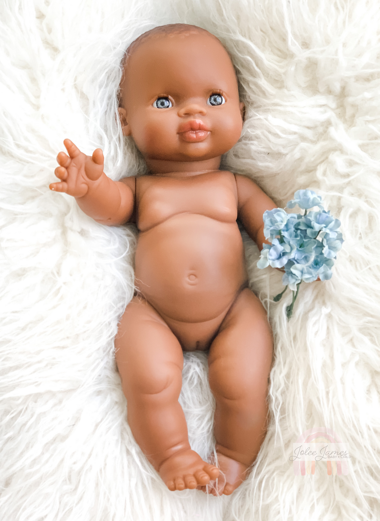 black newborn baby girl with blue eyes